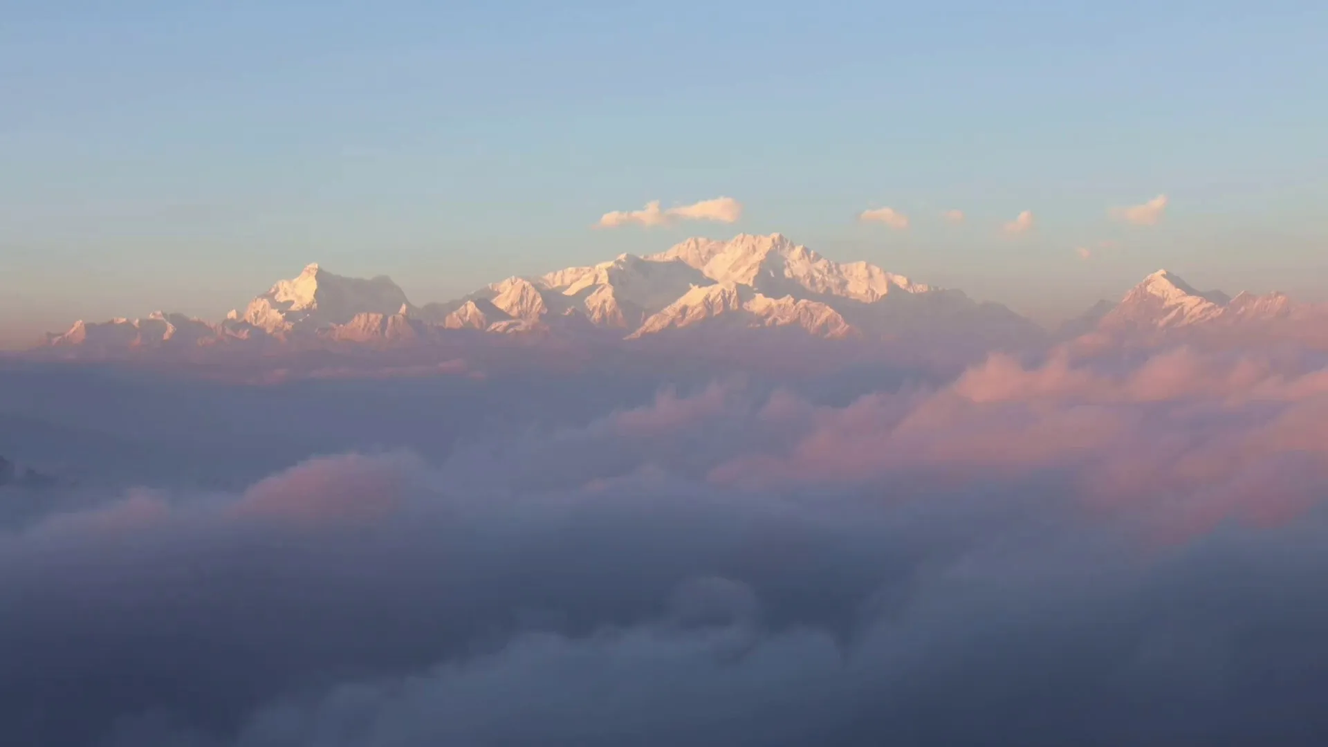 Himalayan peaks above the clouds at sunrise